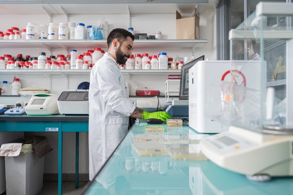 Researcher in Dr Liti's lab with Phenobooth studying genetic variation in yeast.